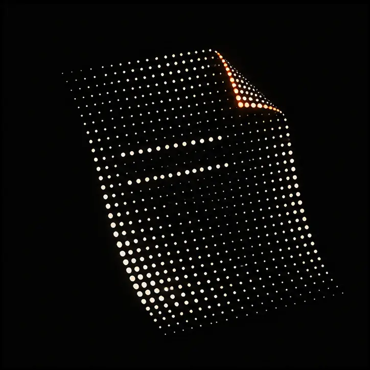 A folded document formed from ivory dots with an orange edge